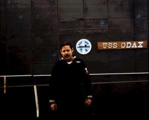 John Rowlingson with Odax name and squadron plaque in background; Leith Scotland 1970