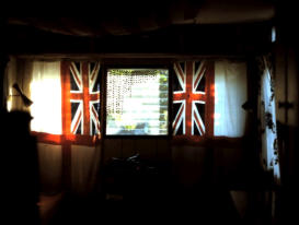 Marathon trailer with flags from Gosport, England sub crew; curtain of beer can tabs 1970