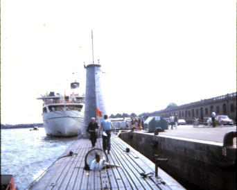 Odax taking on fuel at Copenhagen, Denmark; Jack Feidt (heading forward) 1970